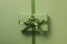 Concept Of Different Ribbons, Gift Box On Green Background