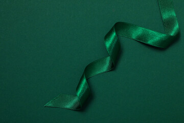 concept of different ribbons, green ribbon on green background