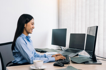 Wall Mural - asian young female programmer working developer programing on a computer code at office.