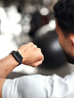 © Beaunitta V W/peopleimages.com - Fitness, app and man with smart watch, time and workout schedule online at gym and sports training. Athlete with digital application, heart rate tracker and tech for exercise and health on stopwatch.