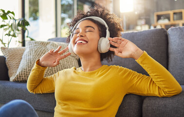 Wall Mural - Headphones, music and happy woman with mental health, wellness dance or youth audio streaming service at home. Relax, floor and dancing of young african person with audio electronics or technology