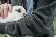 © Westend61 - Man carrying cute white rabbit
