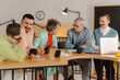 © Westend61 - Group of business people talking in the studio, recording video lesson