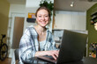 © Westend61 - Smiling freelancer working with laptop at home