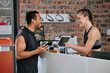 © D Fernandes/peopleimages.com - Talking, tablet fitness and an Asian man with a woman for a gym membership and health app. Happy, showing and an exercise club employee with technology for an athlete for training and sports