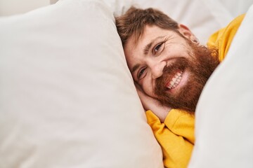 Sticker - Young redhead man smiling confident lying on bed at bedroom