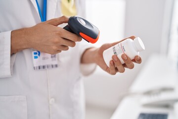 Poster - Young blond man pharmacist scanning pills bottle at pharmacy