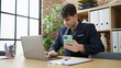 © Krakenimages.com - Young hispanic man business worker using laptop and smartphone at office