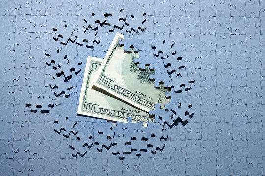 Wall Mural - missing puzzle pieces on american dollars background, save money background, inflation, denomination, bankruptcy concept