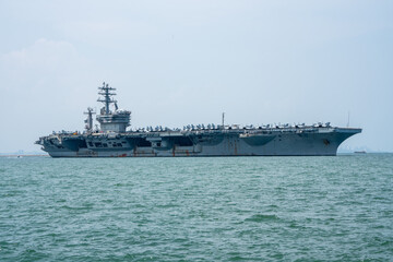 Nuclear War Ship, Military navy ship carrier full loading fighter jet aircraft for prepare troops. forwarder mast. Side view of War Ship.