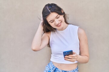 Sticker - Young caucasian woman smiling confident using smartphone over isolated white background