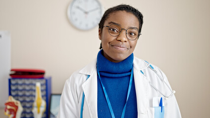 Poster - African american woman doctor smiling confident standing at clinic