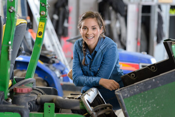 smiling woman in a mechanical workshop