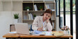 © itchaznong - Deadline with young business woman feeling stressed concept. Business woman working at office, business finance concept