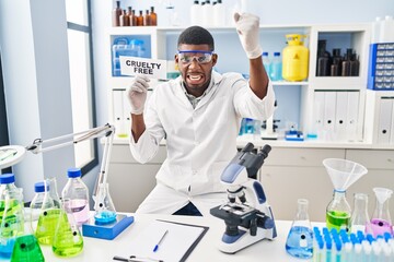 Canvas Print - African american man working on cruelty free laboratory annoyed and frustrated shouting with anger, yelling crazy with anger and hand raised