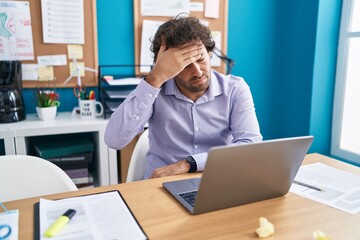 Canvas Print - Young hispanic man business worker stressed using laptop at office