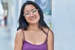 © Krakenimages.com - Young chinese woman smiling confident standing at street