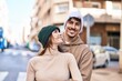 © Krakenimages.com - Mand and woman couple smiling confident hugging each other at street