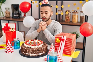 Canvas Print - African american man having wishing celebrating birthday at home