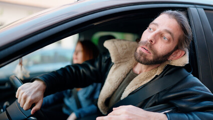 Poster - Man and woman couple driving car at street