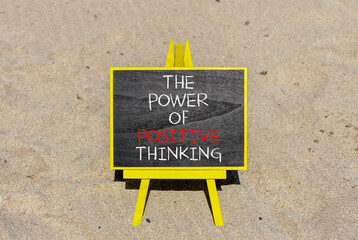 Wall Mural - Positive thinking symbol. Concept words The power of positive thinking on beautiful black chalkboard. Beautiful sea sand beach background. Business, motivational positive thinking concept. Copy space.