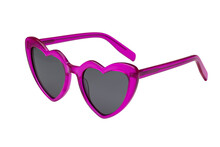 Side view of pink heart shaped sunglasses isolated on transparent background.