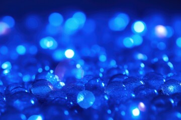 Wall Mural - Abstract blue glass balls, granules bokeh lights background