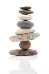 Wall Mural - pyramid of stacked stones on a white background. stabilization and balance in life