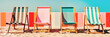 Vibrant striped beach chairs near multicolored colorful wall and blue sky. Bright summer vacation relax background. Created with generative Ai