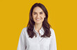 © Studio Romantic - Profile picture studio headshot of business manager or company website consultant. Portrait smiling beautiful young woman in white shirt with perfect teeth isolated on bright yellow colour background