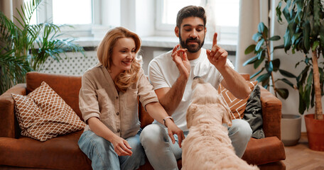 Wall Mural - Couple with dog at home