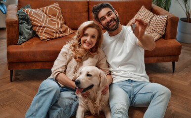 Wall Mural - Couple with dog at home