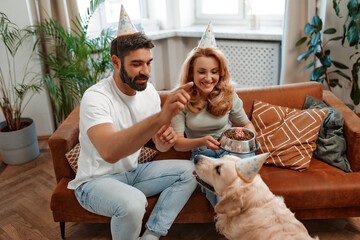 Wall Mural - Couple with dog at home