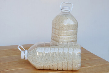 two plastic bottles that contain grains of rice to prevent from dust or insects. diy. concept, reuse