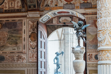 sculpture of cupid with dolphin in the inside contryyard of a palazzo vecchio palace in the old flor