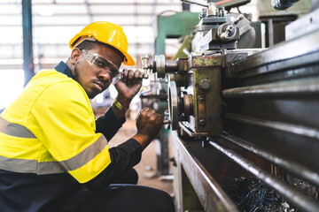 Canvas Print - Production engineers are assisting adjusting and maintaining factory machine, Male workers technician examining control the industrial technology tool, professional repair men work in industry plant