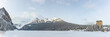 Incredible Lake Louise during winter time with scenic  landscape in panorama, panoramic view with snow covering the frozen lake area. 