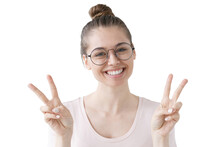 Happy girl showing victory gesture with both hands