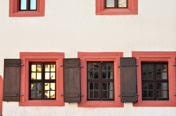 Wall Mural - view of old building with wooden windows and shutters