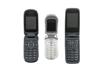 three old flip cell phones isolated with cut out background.