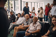 © Regina - Group of people gathered at a blood donation drive, smiling and engaging in conversations while waiting to donate blood. World blood donor day. AI Generative.