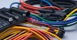 Colorful wire harness and plastic connectors for vehicles, automotive industry and manufacturing.