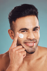 Poster - Portrait, skincare and lotion with a man in studio on a gray background to apply antiaging facial treatment. Face, beauty and cream with a young male person indoor for wellness or aesthetic self care