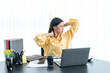 © ND STOCK - Office syndrome concept. Young asian businesswoman feeling pain in neck after working on computer laptop for a long time