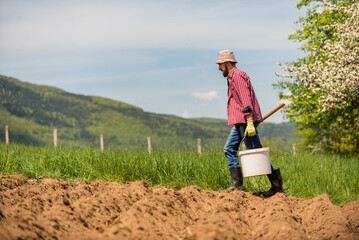 Sticker - Male farmer working on an agricultural fields.