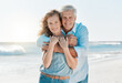 © K.A./peopleimages.com - Senior, couple and portrait hug at the beach for happiness and bond in the outdoor. Mature, man and woman holding one another at the ocean with smile and love for vacation and travel in summer