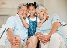 Love, Portrait Of Grandparents With Child Smile And On A Sofa In Living Room Of Their Home. Support Or Care, Generations And Elderly People With Grandchild On Smiling Couch For Bonding Time Together