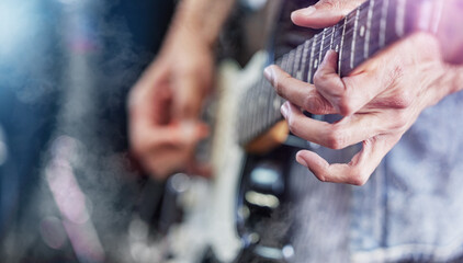 Wall Mural - Guitar, stage and man hands at music festival show playing rock with electric instrument with lights. Sound, musician and party with live talent and audio for punk event with people at a concert