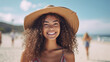 © Kaleidopix - beautiful woman with curly afro hair and hat, at the beach, smiling, summertime. Generative Ai image