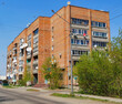 Old multistory apartment building. High-rise. Brickwork. Blue Sky. Ust-Kamenogorsk (kazakhstan)